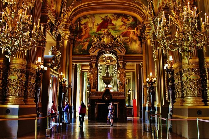 Gilded columns and a painted ceiling along the Grand Foyer