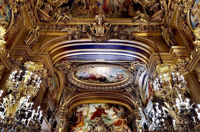 A gilded vault and its chandeliers in the public rooms of the opera house