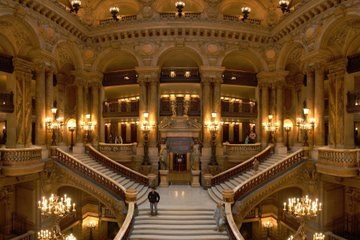 The double flight of the Grand Staircase under its bronze torchères