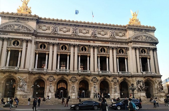 The Paris Opera House seen across the traffic of the Place de l'Opéra