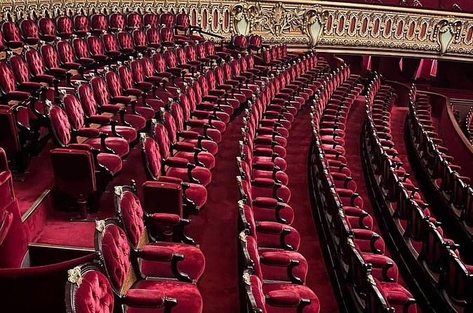 The red velvet seats of the horseshoe auditorium, empty between performances